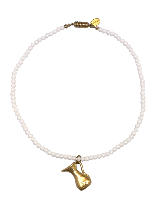 Handmade necklace with white glass beads and a brass jug pendant